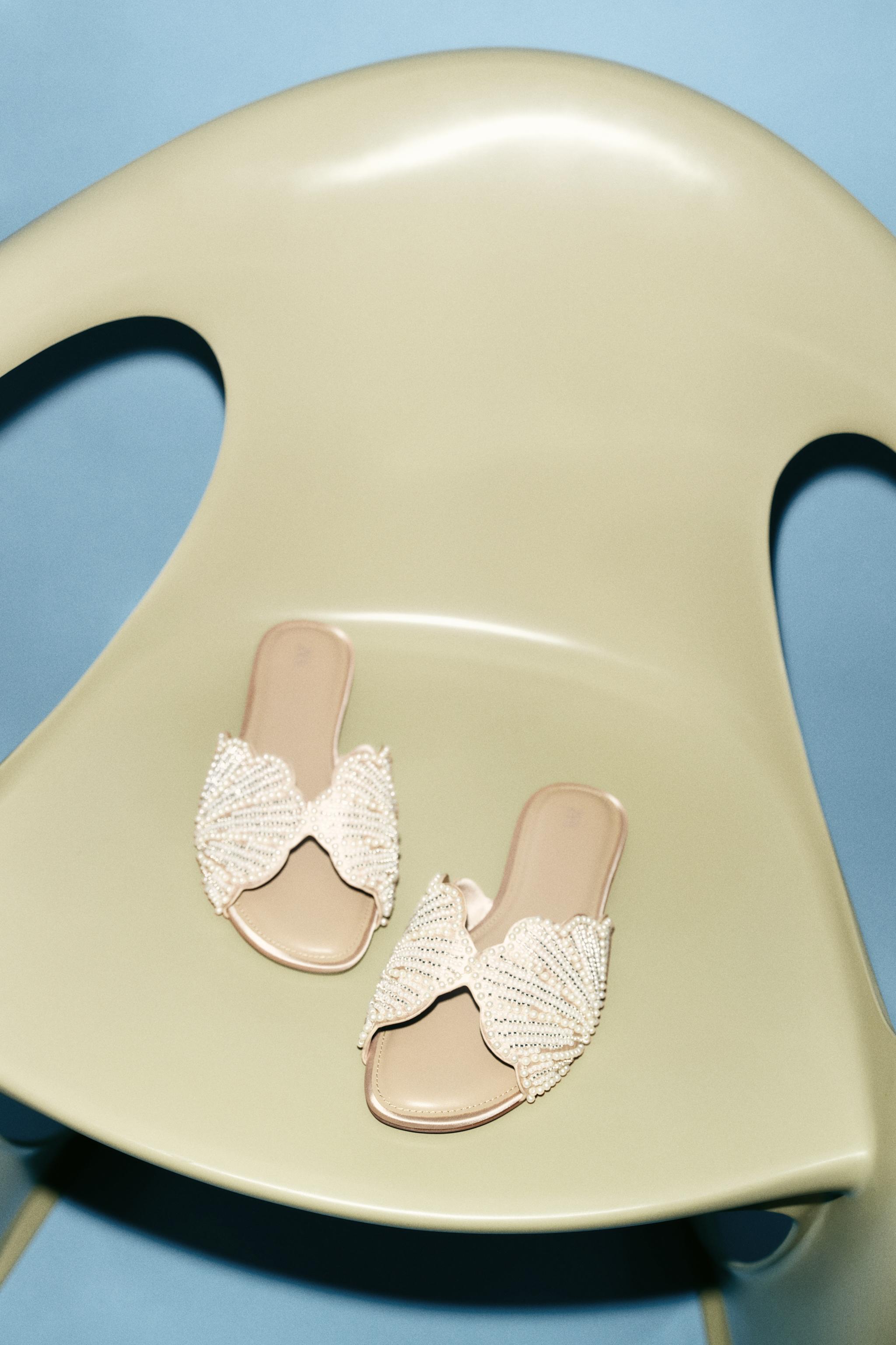 FLAT SANDALS WITH SHINY APPLIQUES